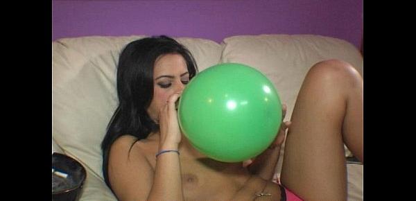  Ava Jay blows to pop balloons